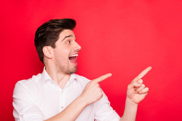 Canvas Print - Close-up portrait of his he nice cheerful cheery amazed guy office employee pointing two forefingers aside ad advert novelty black Friday isolated on bright vivid shine red background