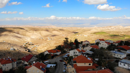 Small town with red rooftops Close to the desert Aerial view Drone shot of Houses Close to the desert in Israel city of Maale adumim