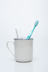 Toothbrush, toothpaste and cup