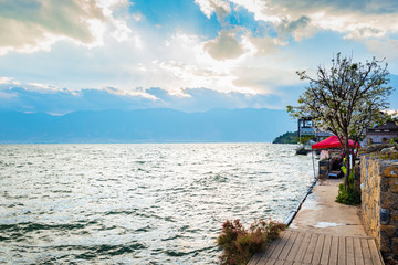 Wall Mural - Landscape of Yunnan. Young people are posing for photos. Located in Erhai Lake, Dali, Yunnan, China.