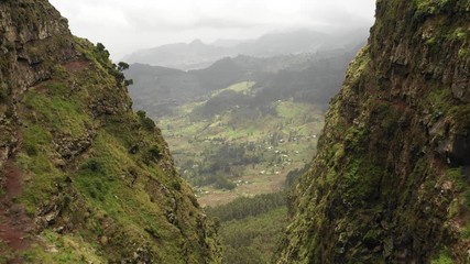 flying through rugged mountain canyon reveals beautiful countryside landscape on high altitude plate