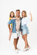 © Drobot Dean - Full length photo of cheery caucasian family woman and man with little girl smiling and showing thumb up