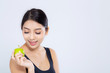 © NT_studio - Portrait asian woman smiling holding green apple fruit and beautiful body diet with fit isolated on white background, girl weight slim with cellulite or calories, health and wellness concept.