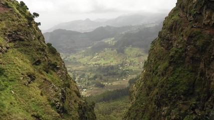 Wall Mural - beautiful drone flight through narrow cliffs reveals spectacular mountain landscape in ethiopia