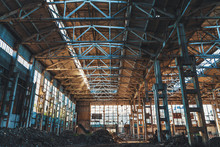 Ruined And Abandoned Industrial Factory Warehouse Hangar With Perspective View