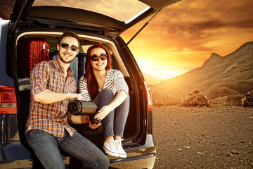 Poster - Two young people and autumn trip of car 