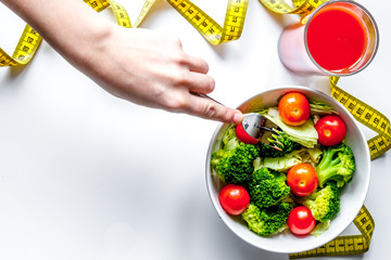 Wall Mural - concept slimming diet fresh vegetables on white background top view