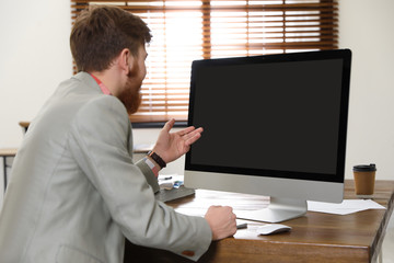 Poster - Man using video chat on computer in home office. Space for text