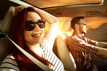 Wall Mural - Young two people in car and autumn trip. Free space for your decoration and sunset time. 