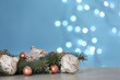 Christmas decoration on table against blurred lights. Space for text