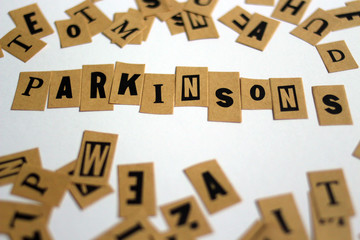 word PARKINSONS spelled out on a table