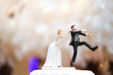 Groom Doll And Statue Is Running Away But Bride Can Catch Him Finally. The Funny Wedding Story Doll On The Top Of Cake.
