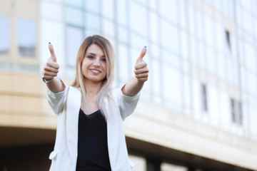 Two woman shows thumb up