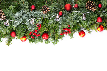 Christmas decorative background border with red bauble decorations, holly berries, spruce and pine cones