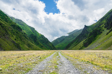 Mountain region landscape in Kazbegi, Georgia - Dramatic landscape of popular adventure trekking and hiking region in the Caucasus. 