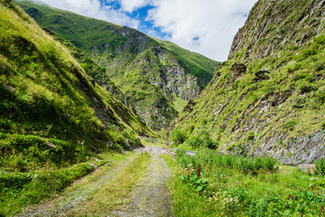 Mountain region landscape in Kazbegi, Georgia - Dramatic landscape of popular adventure trekking and hiking region in the Caucasus. 