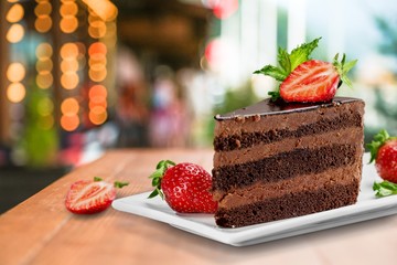 Poster - Slice of delicious chocolate cake on desk