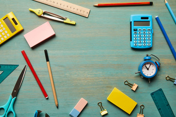 Wall Mural - top view of school supplies at wooden table with copy space