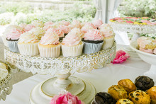 A Beautiful Display Of Cupcakes And Other Pastries.