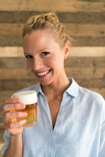 Portrait Of Blond Woman With A Glass Of Beer