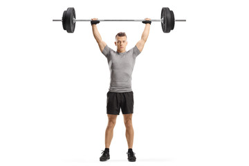 Wall Mural - Young muscular guy lifting weights