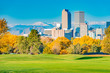 Scenic of Denver Colorado skyline. City Park, Ferril Lake and Rocky Mountains. Located in Denver, Colorado, USA.