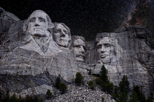 Mt. Rushmore National Memorial Park In South Dakota With Stars And Milky Way Background. Sculptures Of Former U.S. Presidents; George Washington, Thomas Jefferson, Theodore Roosevelt,  Abraham Lincoln