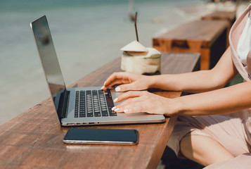 Pretty Young Beauty Woman Using Laptop in cafe, outdoor portrait business woman, hipster style, internet, smartphone, office, Bali Indonesia, holding, mac OS, manager, freelancer 