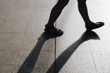 Silhouette people walking in the street 