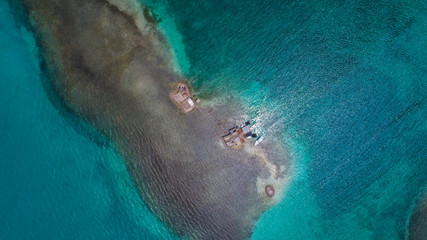 Top down, Aerial view archipelago Los Roques in the blue sea and deserted islands. Crystal water. Beach scene. Island Landscape