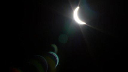 Wall Mural - solar eclipse timelapse. waxing crescent on black sky background