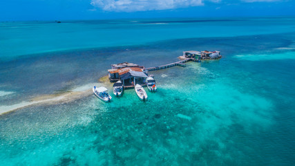 Los Roques Caribbean: Vacation in the blue sea and deserted islands. Aerial view of a blue sea with crystal water. Great landscape. Beach scene.