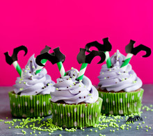 Halloween Witch Cupcakes Decorated With Cream And Witch Legs