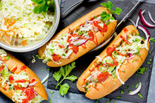 Delicious Hot Dogs With Sausages, Fresh Vegetables And Sauce