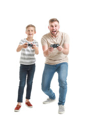 Wall Mural - Portrait of father and son playing video game on white background