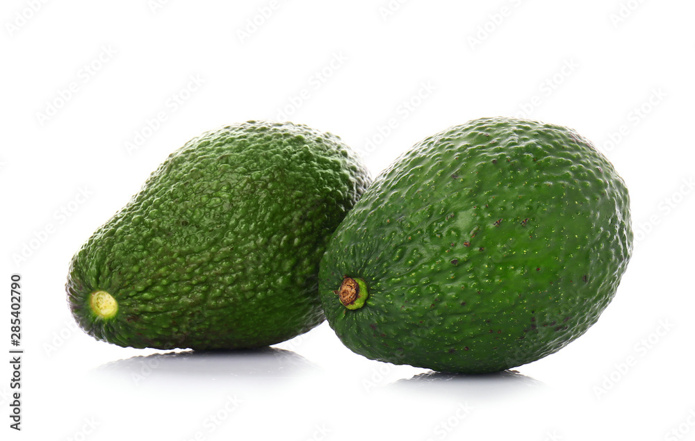 Ripe avocados on white background