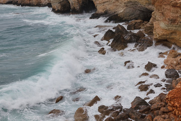 Rocky shore of Cyprus with waves crashing