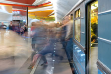 Passenger Flow Concept. People Go On Subway Train. Passengers Are Blurred, Movement Is Shown. Train Station.