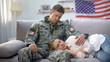US soldier stroking head of sleeping on his knees girlfriend, care and love