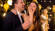 Couple laughing and having fun at corporate party, celebration in night club