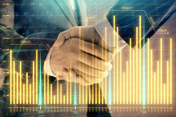 Multi exposure of forex graph on abstract background with two businessmen handshake. Concept of success on stock market