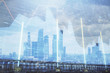 © Andrey - Double exposure of financial graph on downtown veiw background. Concept of stock market research and analysis