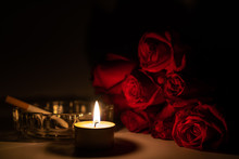 Tealight Candle, Red Roses, Cigarette And Ashtray