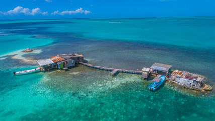 Caribbean: Vacation in the blue sea and deserted islands. Aerial view of a blue sea with crystal water. Great landscape. Beach scene. Aerial View Island Landscape Los Roques