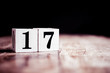 Number 17 isolated on dark background- 3D number seventeen isolated on vintage wooden table