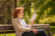 © HD92 - one mature woman, reading aloud while learning from book.