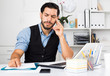© JackF - Spanish male worker is having complicated issue with project