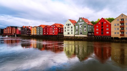 Wall Mural - Trondheim, Norway. City center of Trondheim, Norway during the cloudy summer day. Time-lapse of historical colorful building and grey cloudy sky