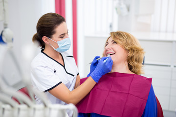 Wall Mural - dentist and patient in modern dentist office