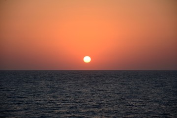 Wall Mural - Sunset at sea in tropical terrain